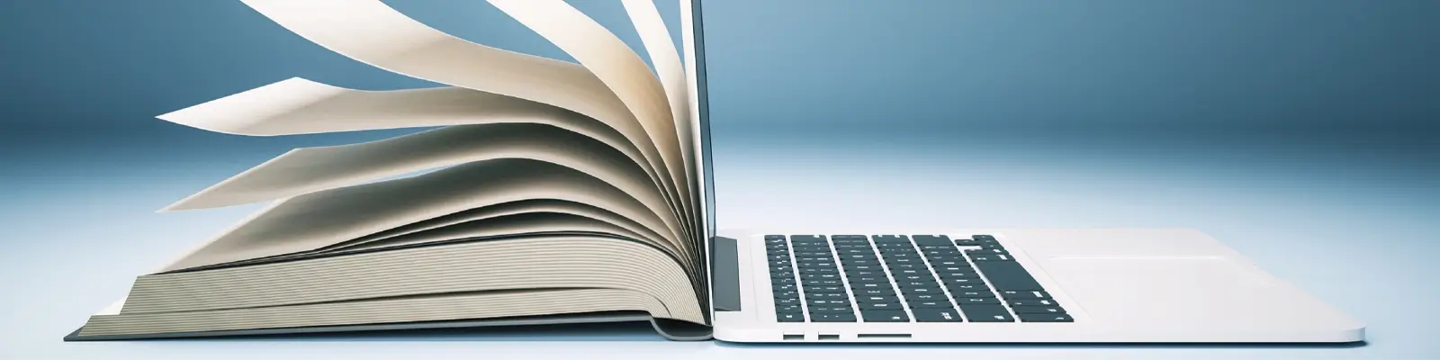Open book and laptop sitting back-to-back